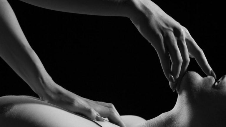 Masseuse giving client a seductive Nuru massage