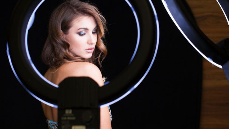 Woman being filmed with ring light effect