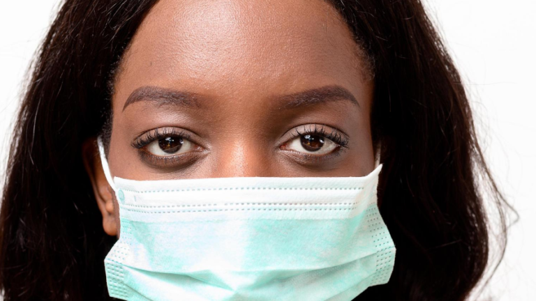 Woman wearing protective face mask for COVID-19