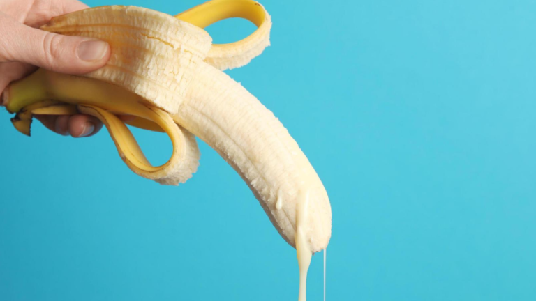 Banana with dripping condensed milk for man ejaculation concept