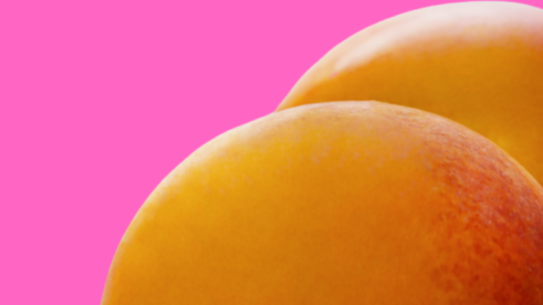 Two peaches in the form of a bottom to represent anal sex