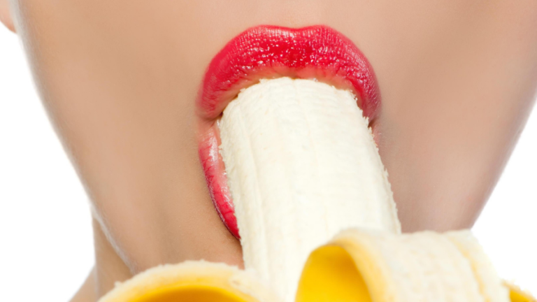 Woman with banana in her mouth representing oral sex