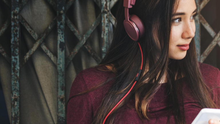 Woman listening to adult podcasts on her phone