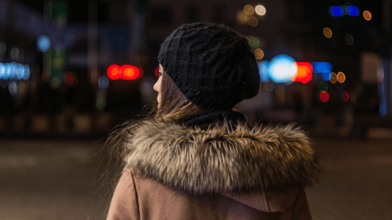 Woman walking at night alone