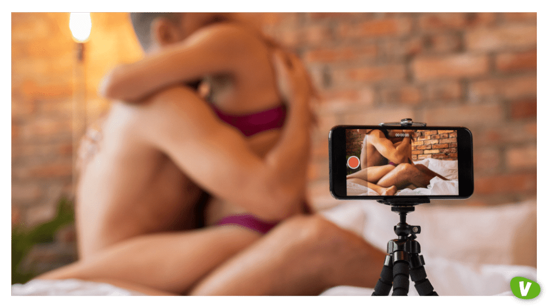 man and woman having sex filming themselves on a mobile phone