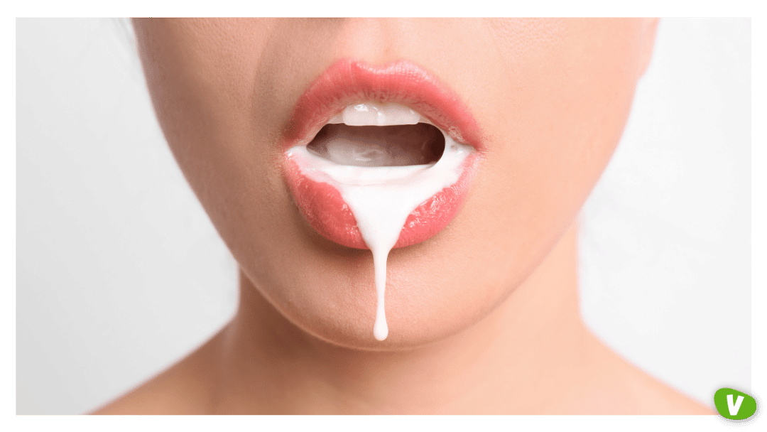 close up of a woman's mouth with liquid dripping out of it cum play concept