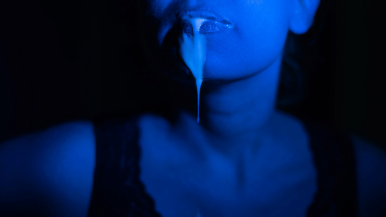 spit dripping down woman's lips