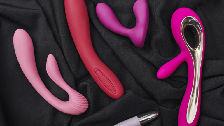 close up photo of colorful various sex toys: dildos prostate massager, g-spot vibrators and others