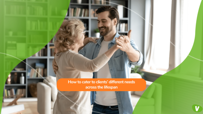 senior woman dancing with a young man in the living room