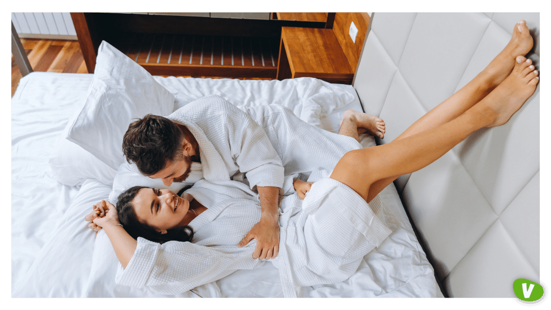 man and a woman on the bed in bath robes