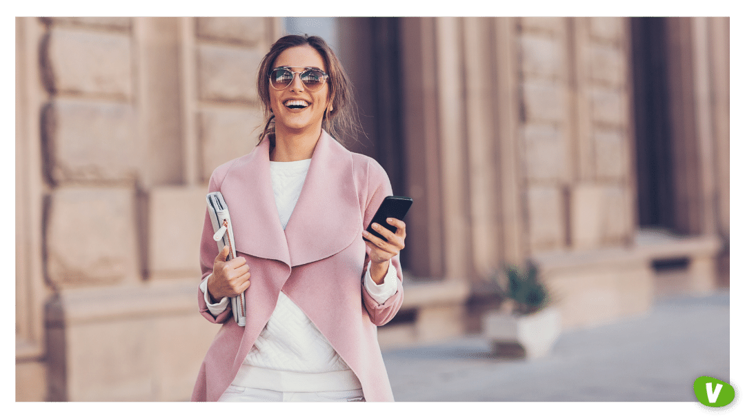 smiling woman walking around town