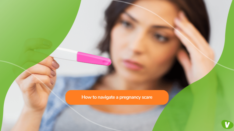 An anxious woman holding a home pregnancy test, coping with a pregnancy scare