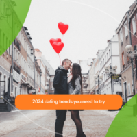 couple kissing on an empty street, the man holding heart-shaped balloons