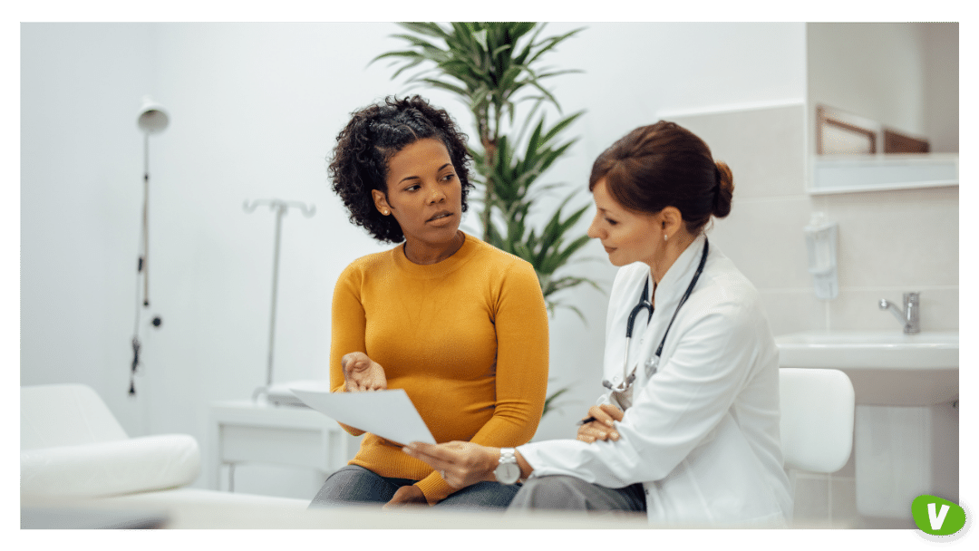 young woman talking to a doctor about her medical results