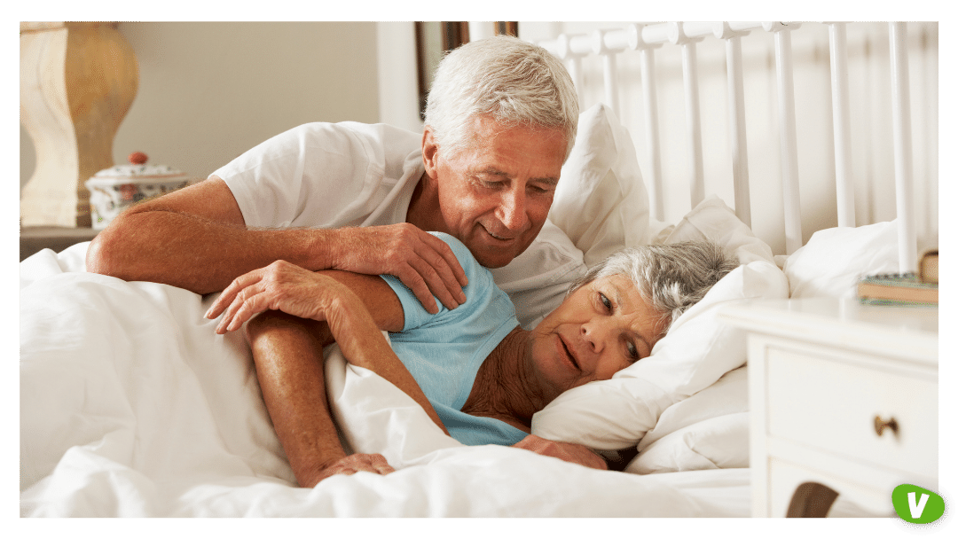 senior man trying to affectionate to his wife in bed