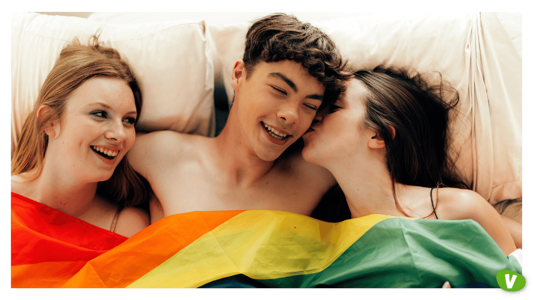 polyamory of young people engage in multiple romantic relationships - male and female threesome under a rainbow flag, swinging