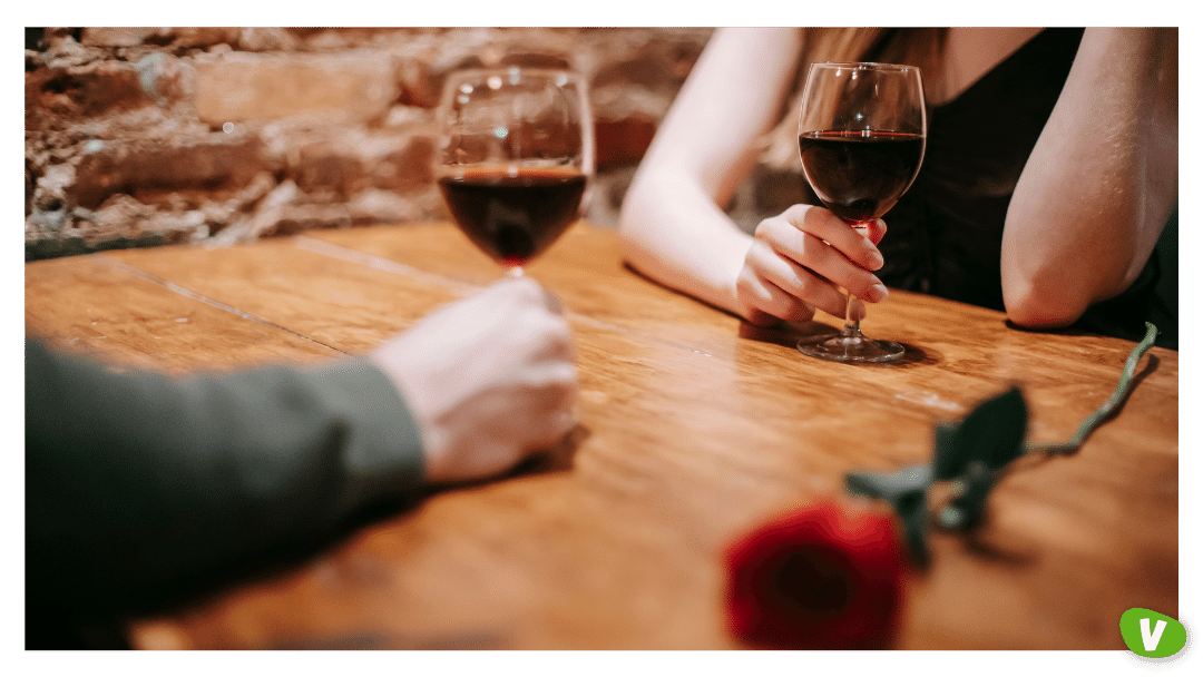 couple on a date drinking red wine