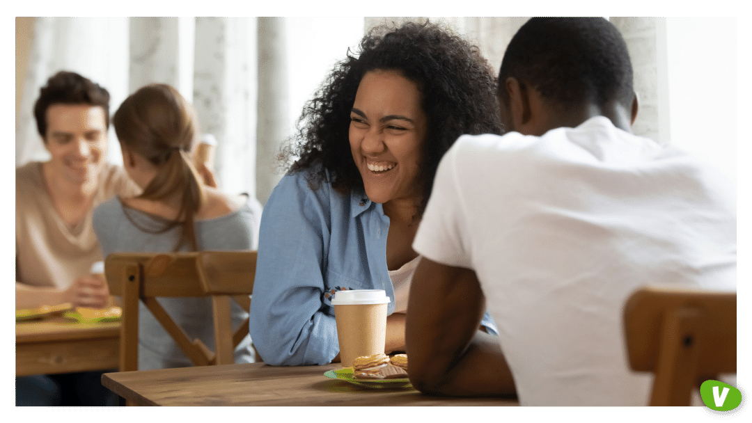 Happy young mixed race girl attending speed dating