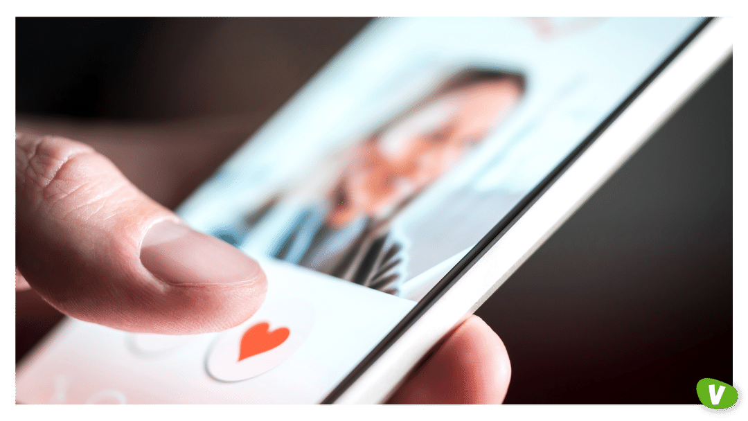 Dating app or site in mobile phone screen. Man swiping and liking profiles on relationship site or application. Single guy using smartphone to find love, partner and girlfriend