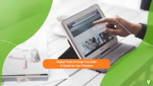 A person uses a tablet on a desk, browsing a website that appears to show digital tools or safety resources. Overlaid text reads: “Digital Tools to Keep You Safe: A Guide for Sex Workers.” The background features green and orange graphic elements.